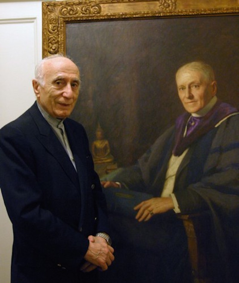 Ehsan Yarshater, the founder and director of the Encyclopedia Iranica at Columbia University, stands in front of portrait of Dr. Abraham V.W. Jackson, 1862-1937, a Professor of Indo-Iranian languages at Columbia University at the turn of the 20th century